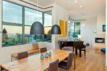Beautiful living room with hardwood floors and amazing view at sunset.