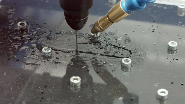 close up shot of a small cnc router machine milling plastic parts