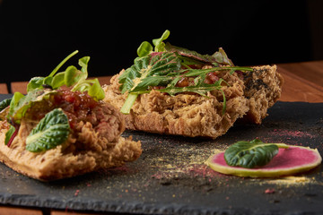 food background of Bread with duck meat and salad