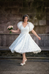 Lady swooshes her vintage retro wedding gown