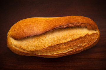 Fresh bread on wooden background