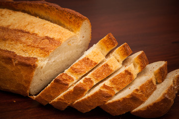 Fresh bread on wooden background