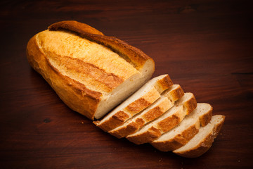 Fresh bread on wooden background