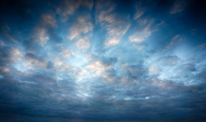 Obraz premium blue sky feather clouds, sunset with reflection on clouds, HDR 