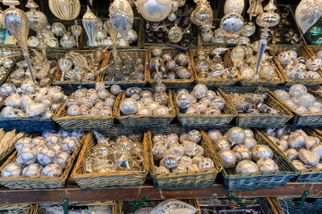Colorful close up details of christmas fair market. Balls decora
