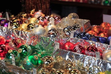 Colorful close up details of christmas fair market. Balls decorations for sales.