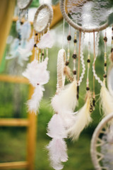 Dream catchers as the main element of the wedding arch. Boho and rustic theme