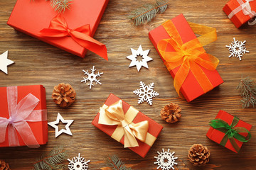 Christmas concept. Gift boxes and decorations on wooden background