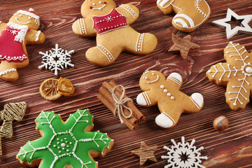 Tasty Christmas cookies and decor on wooden table, close up view