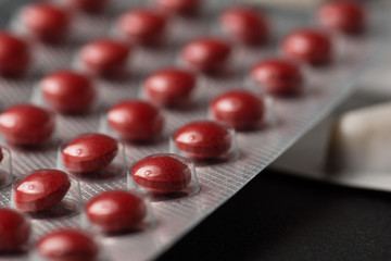 Multiple pills depicting medical treatment or pahrmaceutical ind