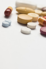 Fototapeta na wymiar Multiple pills depicting medical treatment or pahrmaceutical ind