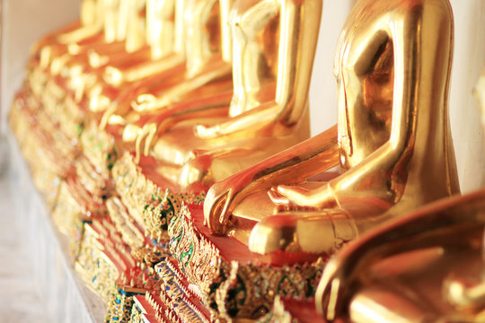 Row of golden buddha statue (Selective focused)