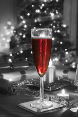 A Glass of Rose Champagne on a decorated Christmasdinner table