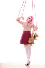 woman girl stylized like marionette puppet on string