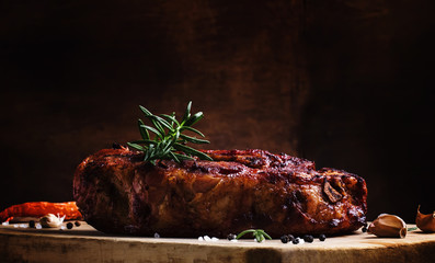 Baked pork shoulder with pepper, rosemary and garlic, vintage wo