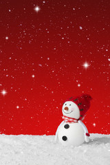 Snow falling on a White Christmas decoration snowman