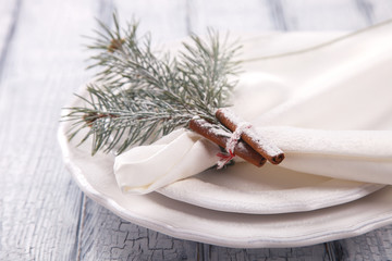  Christmas Table Setting with Christmas pine branches. Christmas Holidays Background.Holiday Decorations. Happy New year.White Wooden Background with crackling effect.top view.  selective focus.