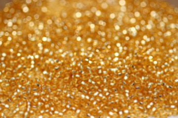 Abstract christmas golden lights on background. Defocused.