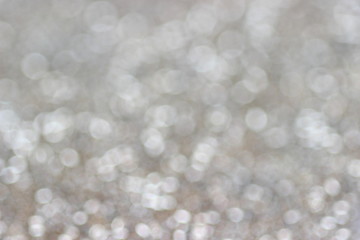 Abstract christmas silver lights on background. Defocused.