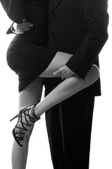 Businessman holding long leg of his secretary isolated on white