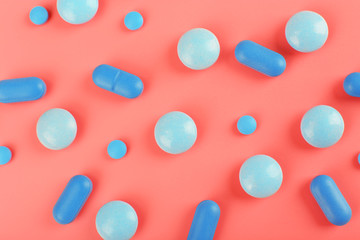 Color pills on pink background