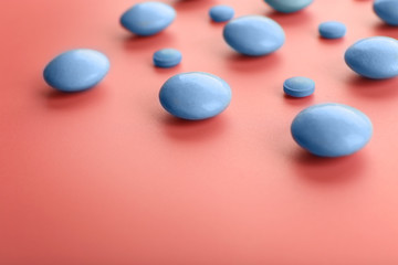 Color pills on pink background