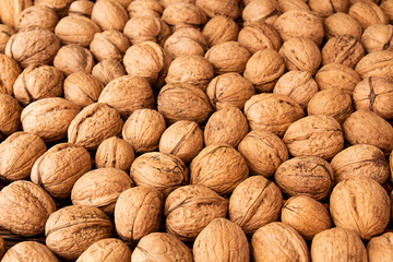 Walnuts background. Walnuts texture. Group walnuts on wooden bac