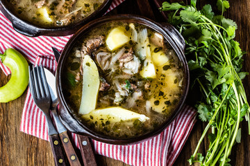 Traditional chilean latinamerican meat soup ajiaco served in clay plate