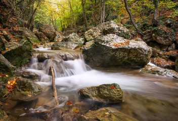 Beautiful autumn landscape with mountain river and colorful trees