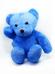 Blue teddy bear against a white background
