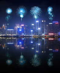 Fireworks Festival over Hong Kong city with water reflection
