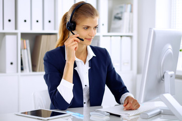 Modern business woman in headset the office