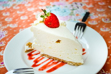 strawberry cheese cake on colorful table