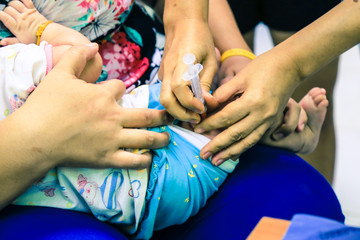 Fototapeta premium Children receiving vaccine at out side of the thigh.Children vac