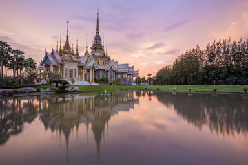 Fototapeta na wymiar Wat Luang Pho Toh temple with water reflection in twilight time,