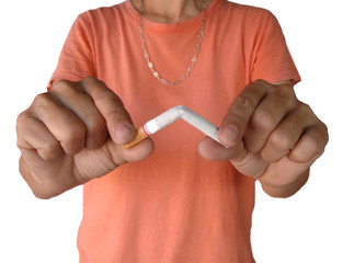 Quit smoking - female hand crushing cigarette isolated on white background