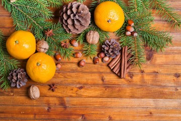 Christmas background. Christmas decorations and spice on wooden table. Top view, copyspace.