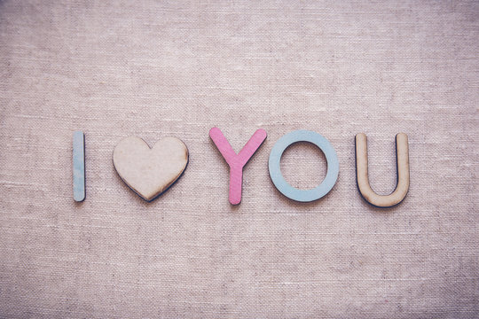 I love you made from wooden letters and heart shape wood, Valentines toning background