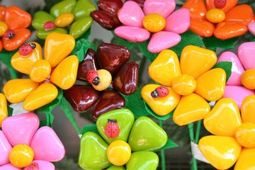 Fototapeta na wymiar Typical Sulmona's confetti, almond candies in shape of bunches of colored flowers 