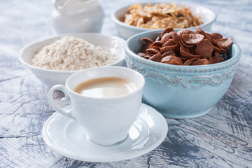 coffee and grain flakes on a table, selective focus