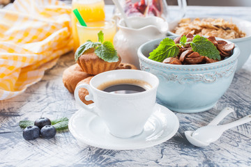 coffee, flakes and cakes on a table, selective focus