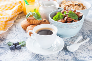 coffee, flakes and cakes on a table, selective focus