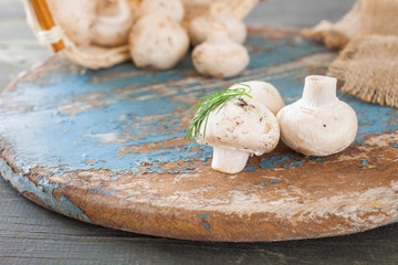 champignon mushrooms on a table, selective focus