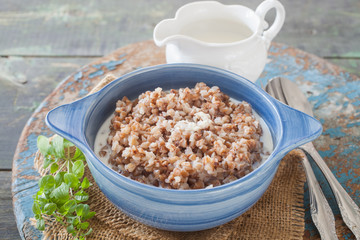 buckwheat cereal in a bowl on a table, selective focus