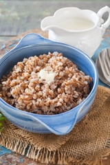 buckwheat cereal in a bowl on a table, selective focus