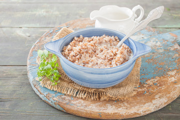 buckwheat cereal in a bowl on a table, selective focus