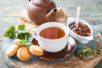tea and jam on a table, selective focus, rustic style