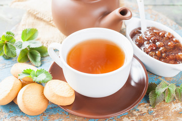 tea and jam on a table, selective focus, rustic style