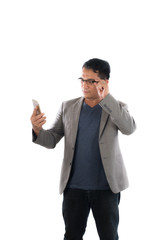 Handsome businessman and glasses standing and looking on mobile