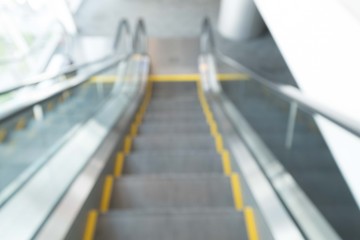 Blur modern steps of moving business escalator